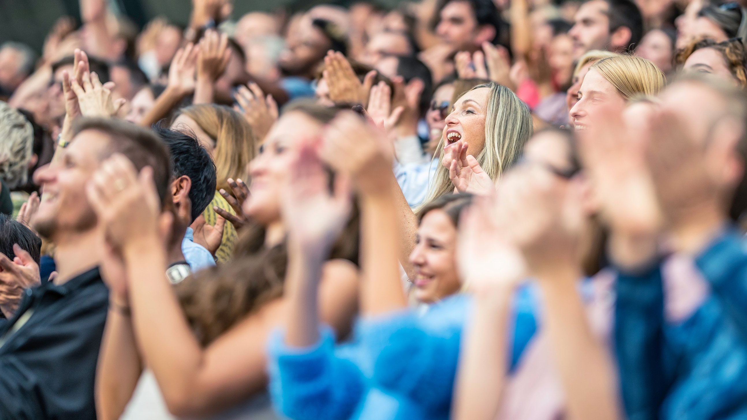 Stadium crowd cheering and clapping